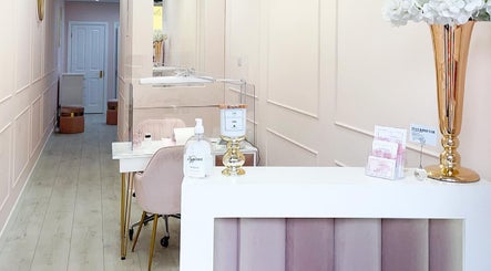 Elegant interior of YM London nail salon, London, England, GB, with pastel decor and stylish furnishings.