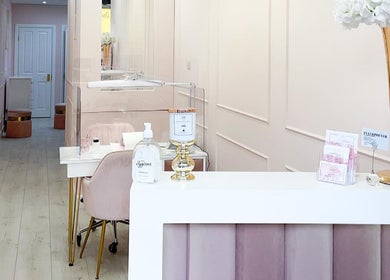 Elegant YM London salon interior with neutral tones and chic decor, located in London, England, GB.