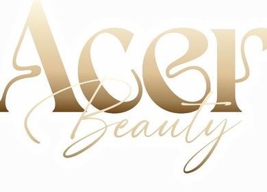 Acer Beauty logo in elegant gold script, Carlisle, England, GB.