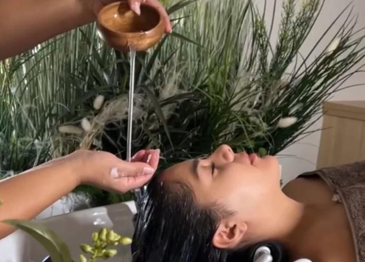 Relaxing hair treatment at Skin & Scalp, Mississauga, Ontario, CA with greenery in the background.