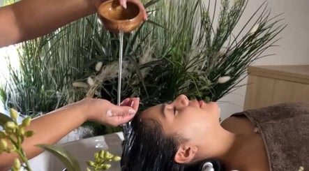 Relaxing hair treatment at Skin & Scalp, Mississauga, Ontario, CA with greenery in the background.