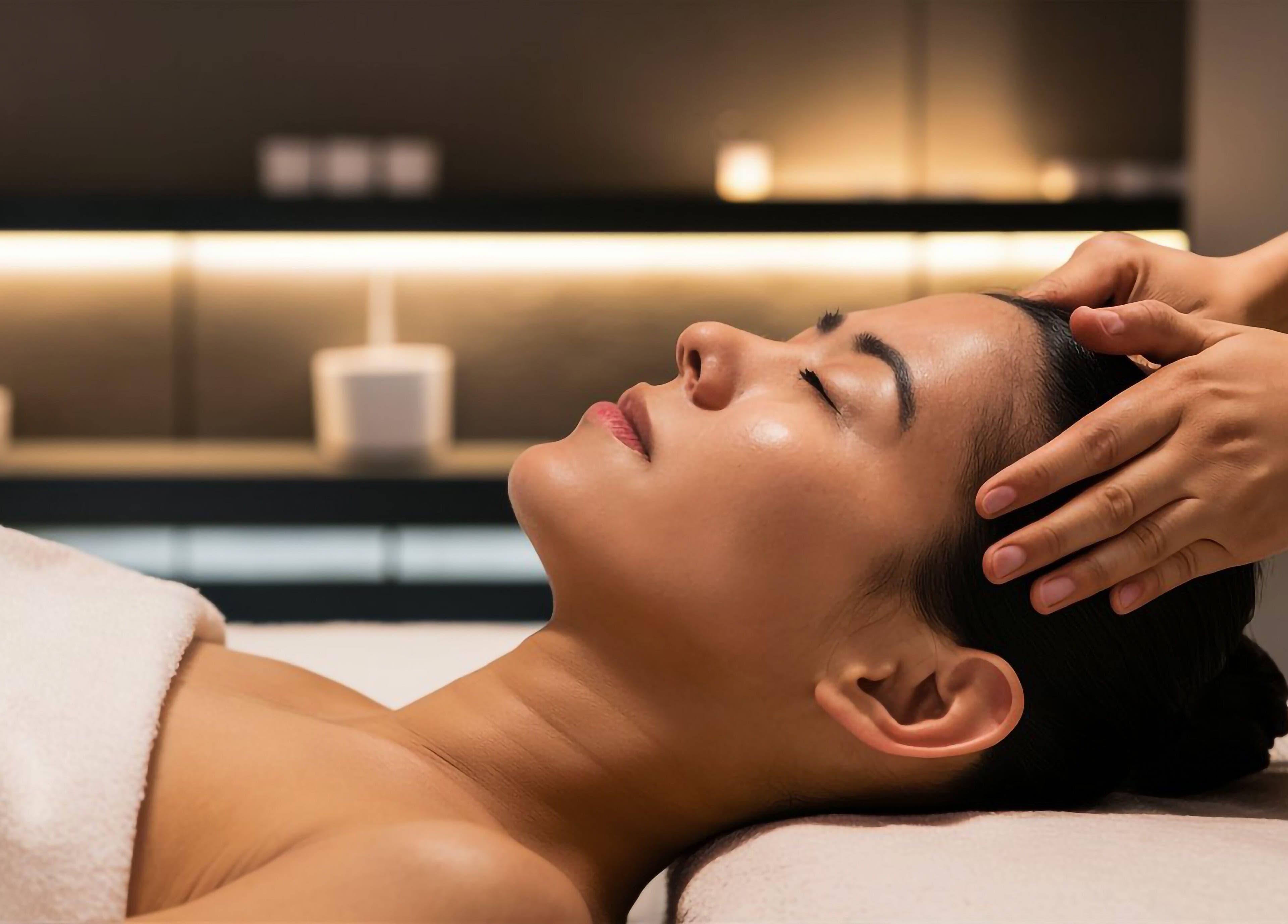 Relaxing head massage at Skin & Scalp in Mississauga, Ontario, CA offering serene wellness experiences.