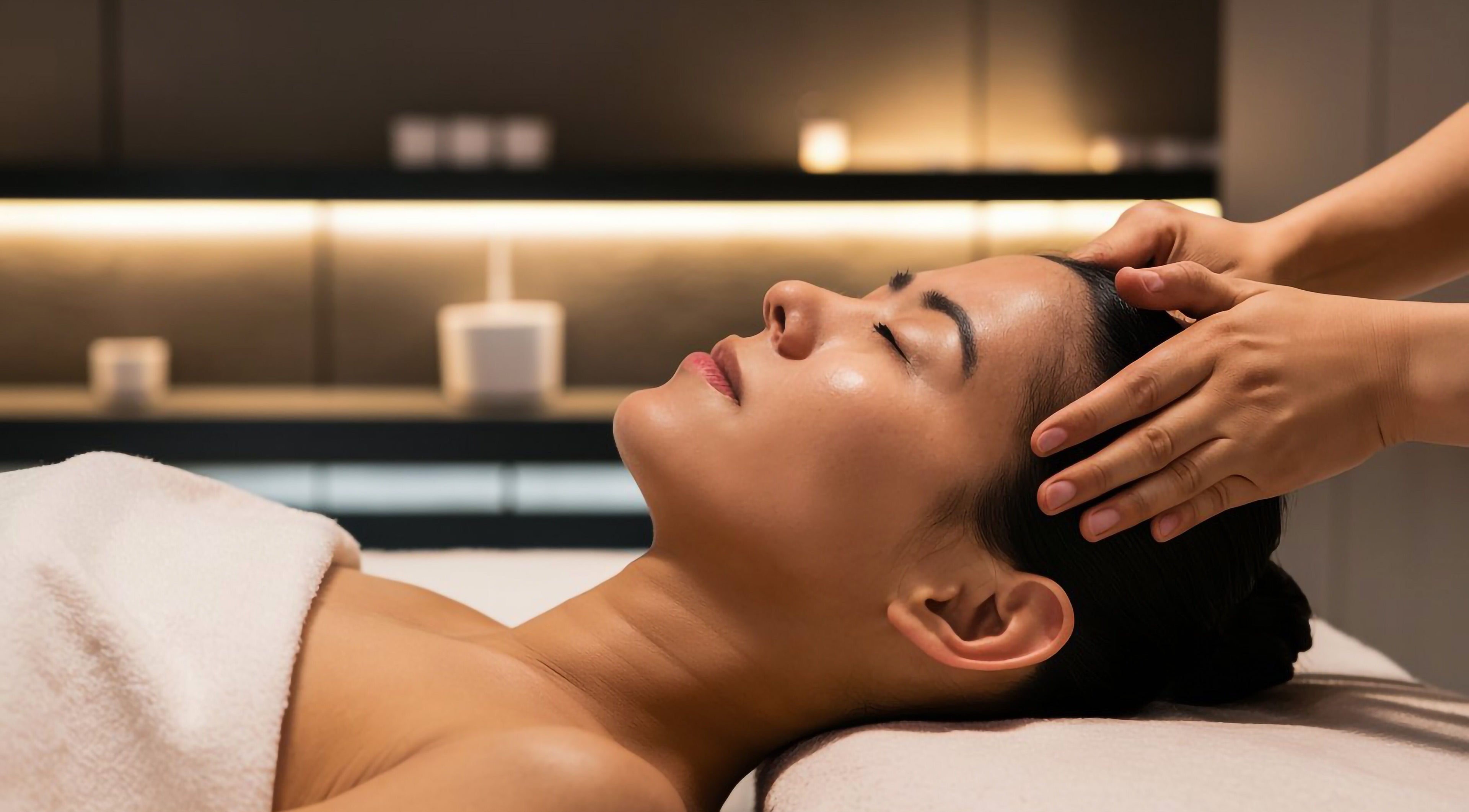 Relaxing head massage at Skin & Scalp in Mississauga, Ontario, CA offering serene wellness experiences.