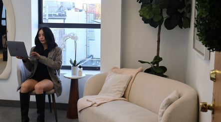 Elegant office corner at Bymilauryss in New Brunswick, New Jersey, US with cozy seating and stylish decor.