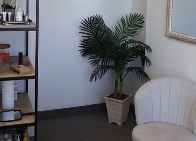 Cozy waiting area at Bymilauryss, New Brunswick, New Jersey, US, featuring a chic chair and elegant decor.