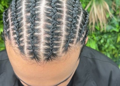 Intricate braids at Empress Beauty Empire in Manchester, England, GB, showcasing expert hair styling.