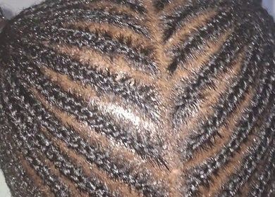 Detailed cornrow hairstyle at Empress Beauty Empire, Manchester, England, GB.