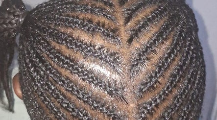 Detailed cornrow hairstyle at Empress Beauty Empire, Manchester, England, GB.