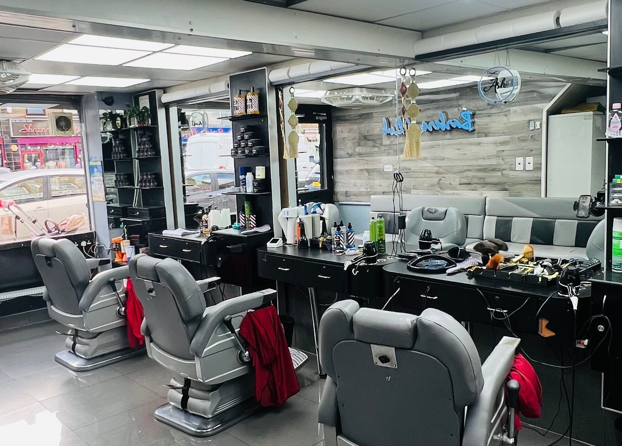 Interior of A1 Hair Style salon in London, England, GB with modern styling chairs and mirrors.