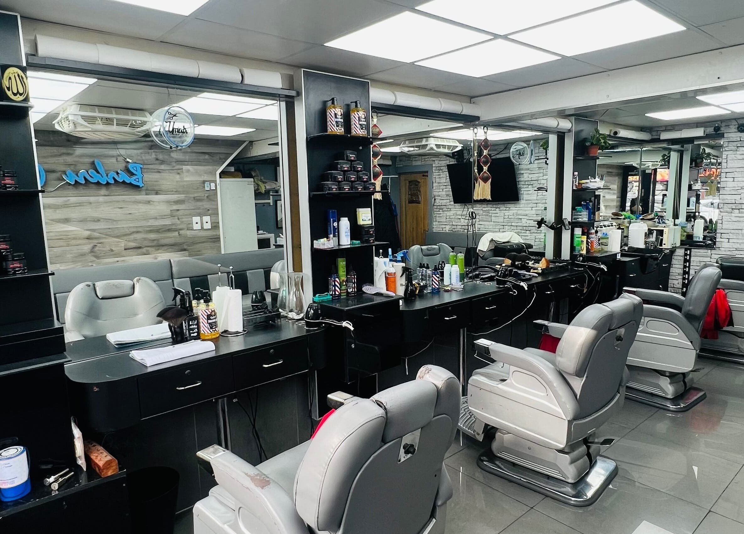 Modern salon interior at A1 Hair Style in London, England, GB with sleek styling stations and chairs.