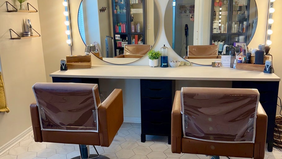Modern salon chairs and mirrors at Brinley Studio, Lehi, Utah, US. Stylish and inviting beauty venue.