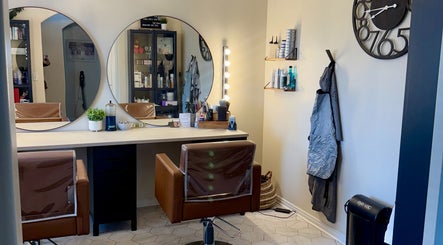 Elegant salon interior at Brinley Studio, Lehi, Utah, US with stylish chairs and mirrors.