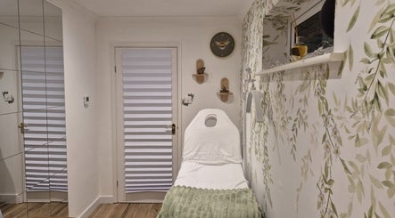 Relaxing spa room at Beauty by Basak in Nettleham, England, GB with a treatment bed and calming decor.