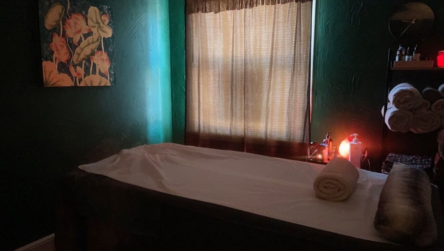 Cozy massage room at Ann’s Thai Massage in March, England, GB with serene lighting and decor.