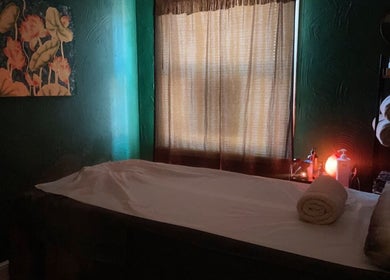 Cozy massage room at Ann’s Thai Massage in March, England, GB with serene lighting and decor.