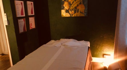 Cozy massage room at Ann’s Thai Massage, March, England, GB with warm lighting and soothing decor.