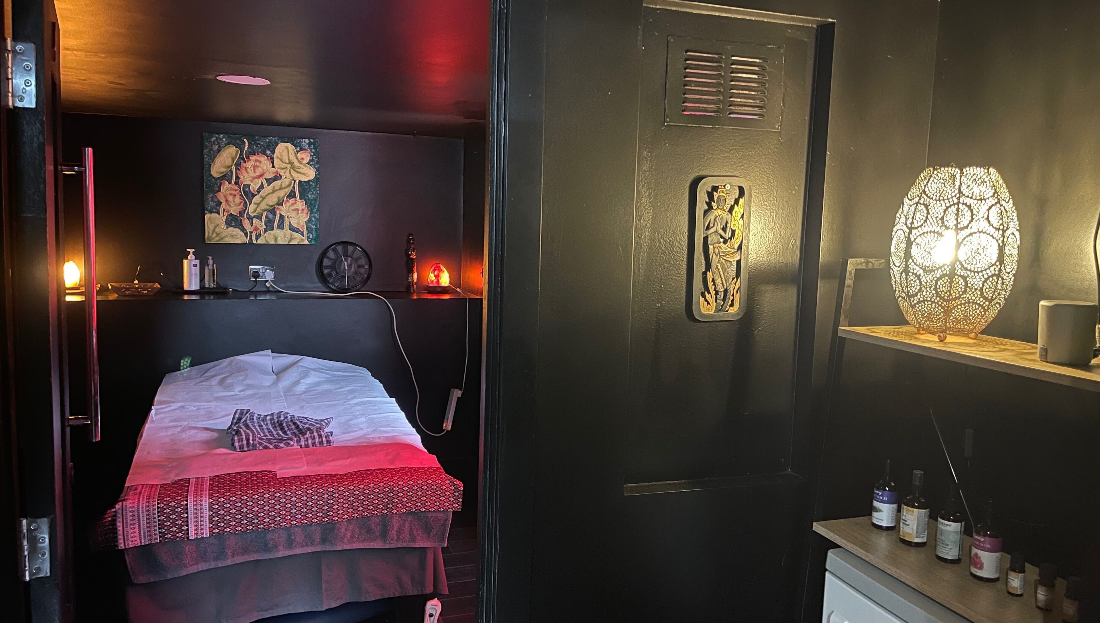 Relaxing massage room at Ann’s Thai Massage, March, England, GB, with warm lighting and elegant decor.