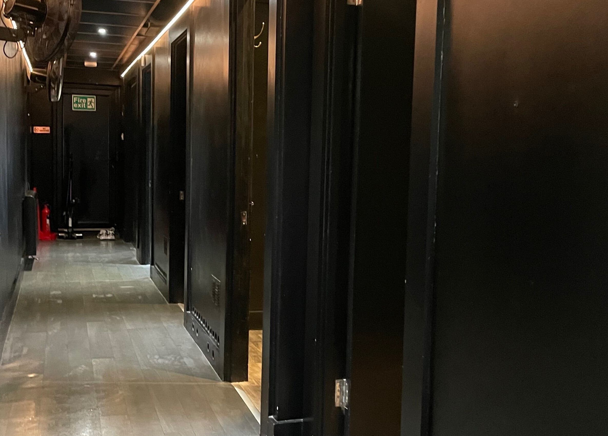 Dimly lit hallway at Ann's Thai Massage, March, England, GB, evoking calmness and privacy.