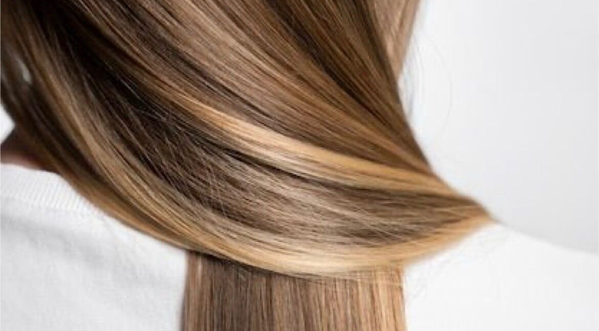 Smooth, shiny brown hair with highlights at Glitz.Care.Bar, New Westminster, British Columbia, CA.