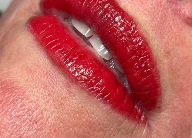 Lush red lips showcased at Js Semi Permanent Make Up By Jodie in Sturry, England, GB.