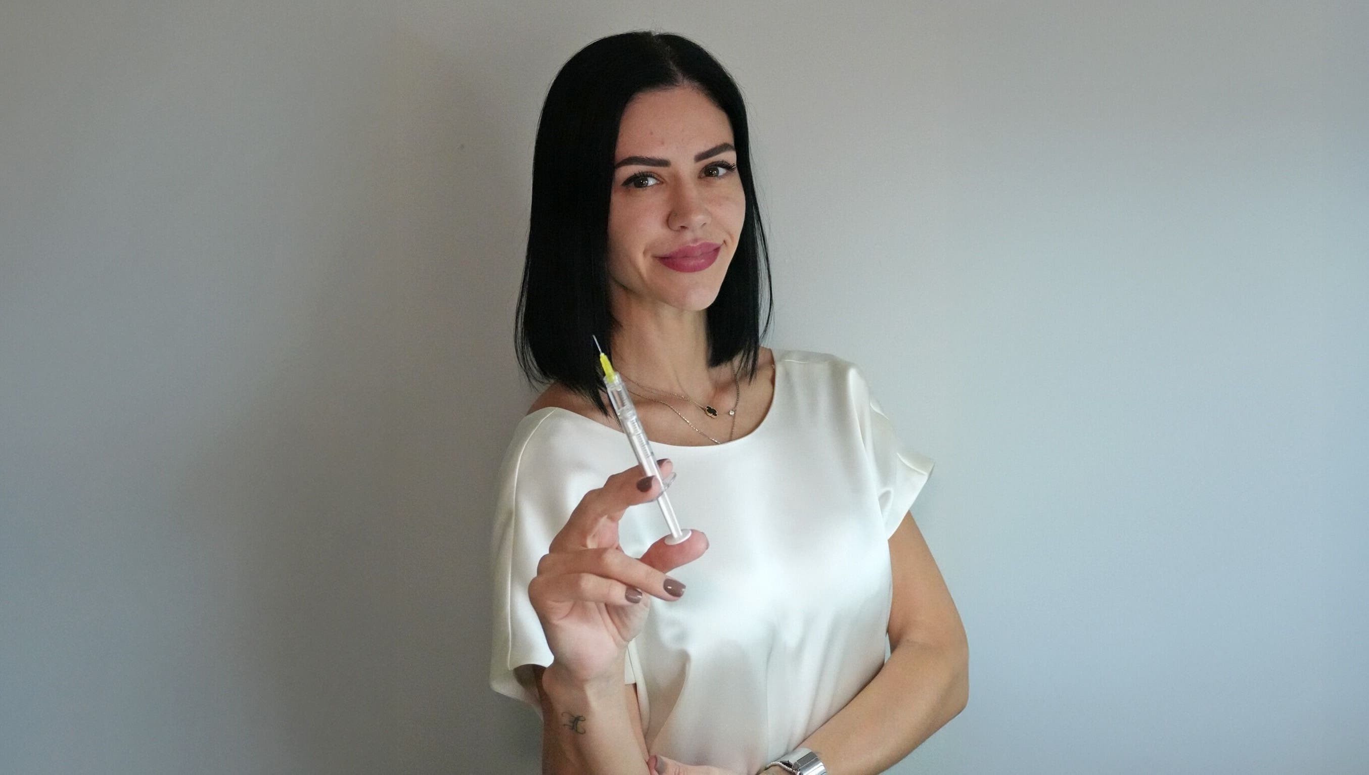 Professional injector at Nivelle Aesthetics, Schaumburg, Illinois, US, ready with a syringe.