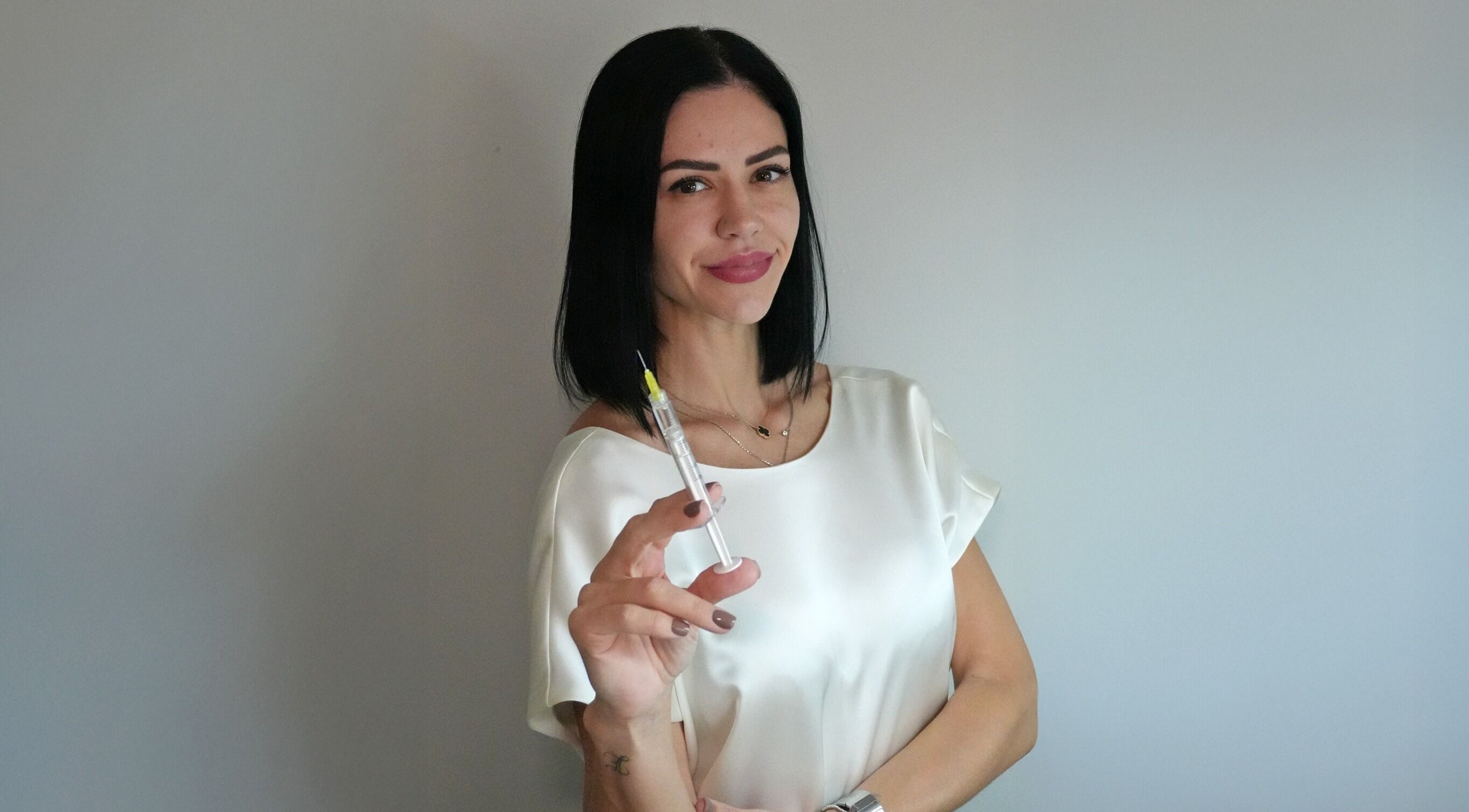 Professional injector at Nivelle Aesthetics, Schaumburg, Illinois, US, ready with a syringe.