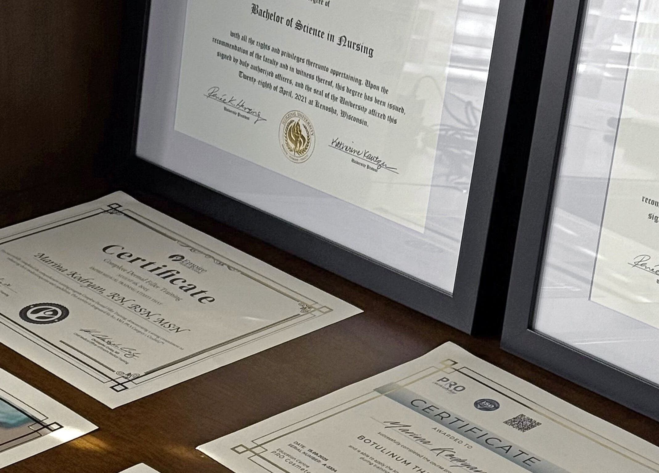 Certificates displayed at Nivelle Aesthetics, showcasing expertise in Schaumburg, Illinois, US.