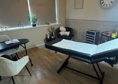 A serene treatment room at RA Aesthetics, Leyland, England, GB, designed for comfort and relaxation.