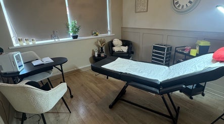 A serene treatment room at RA Aesthetics, Leyland, England, GB, designed for comfort and relaxation.