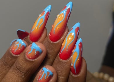 Bright nail art with orange and blue drips at 44 Sculpted Nails, Kingston, St. Andrew Parish, JM.