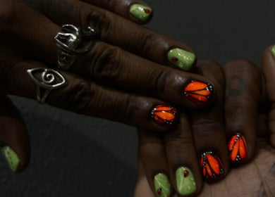 Colorful nail art at 44 Sculpted Nails, Kingston, St. Andrew Parish, JM, showcasing vibrant designs.