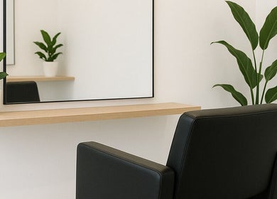 Elegant salon station at 5ineStyles, Slough, England, GB, featuring a large mirror and stylish seating.