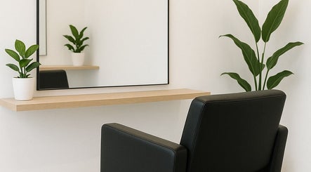 Elegant salon station at 5ineStyles, Slough, England, GB, featuring a large mirror and stylish seating.