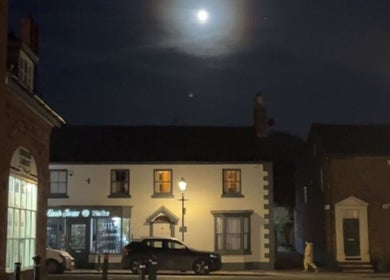 Charlotte Elizabeth Tattoos in Tarporley, England, GB, at night under a bright moonlight.
