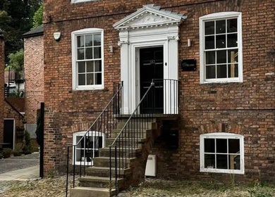 Elegant brick facade of Charlotte Elizabeth Tattoos in Chester, England, GB, showcasing the venue's classic architecture.