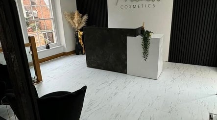 Reception area of Charlotte Elizabeth Tattoos in Chester, England, GB with modern design and natural light.