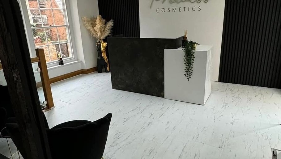 Reception area at Charlotte Elizabeth Tattoos, Chester, England, GB with sleek decor and natural light.