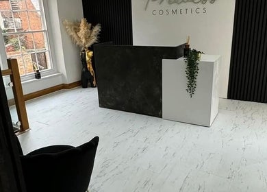 Reception area at Charlotte Elizabeth Tattoos, Chester, England, GB with sleek decor and natural light.