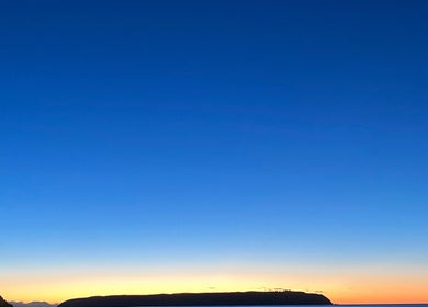 Peaceful sunset view over Porirua beach near Beach Bliss Massage, Wellington Region, NZ.