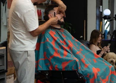 Barber crafting a stylish look at Motown Granby, Granby, Quebec, CA with a client in focus.