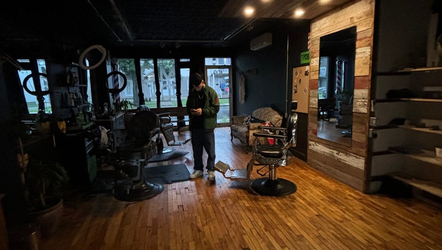 Cozy interior of Motown Granby with wooden floors and vintage barber chairs in Granby, Quebec, CA.