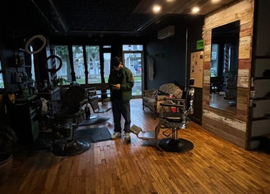 Cozy interior of Motown Granby with wooden floors and vintage barber chairs in Granby, Quebec, CA.