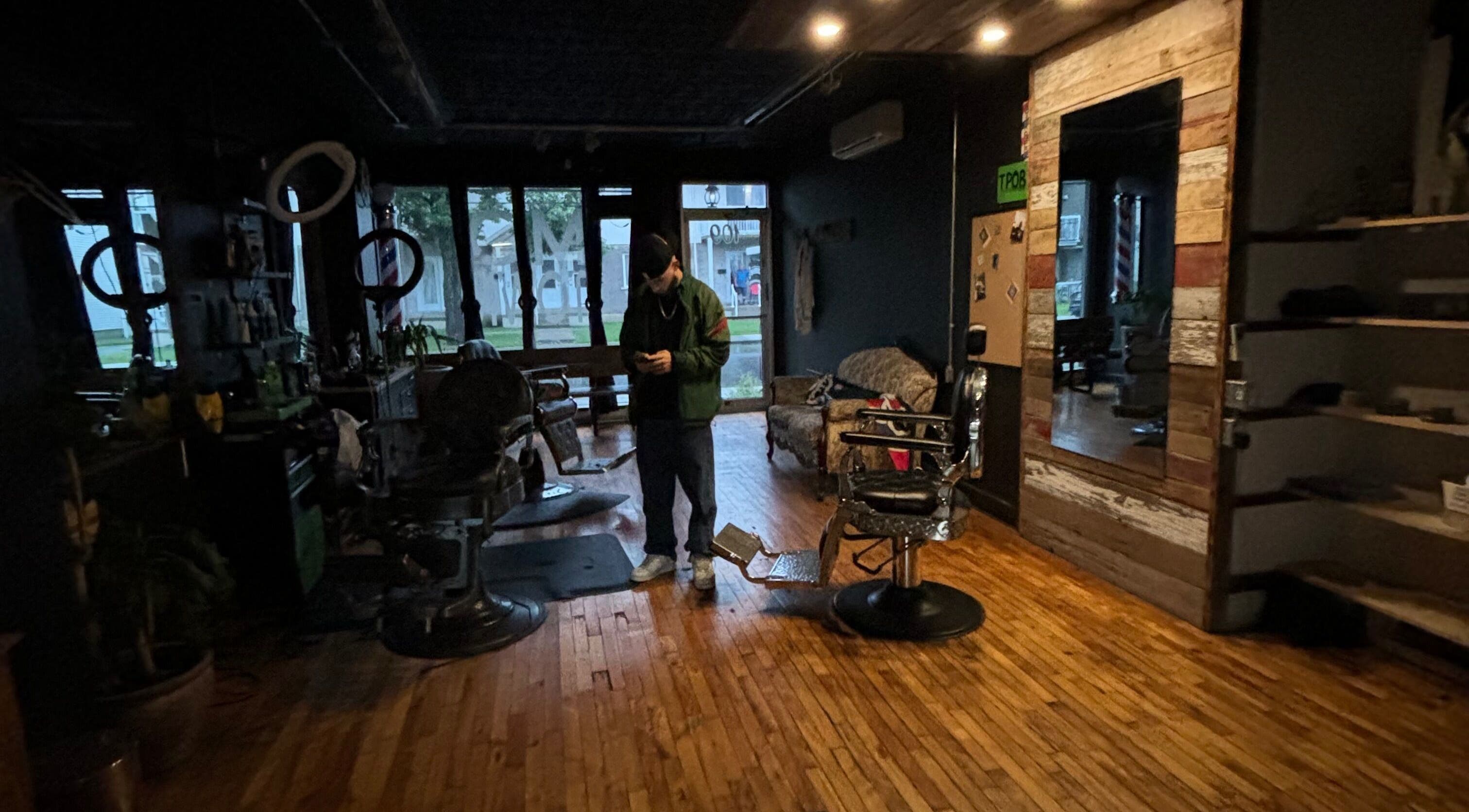 Cozy interior of Motown Granby with wooden floors and vintage barber chairs in Granby, Quebec, CA.