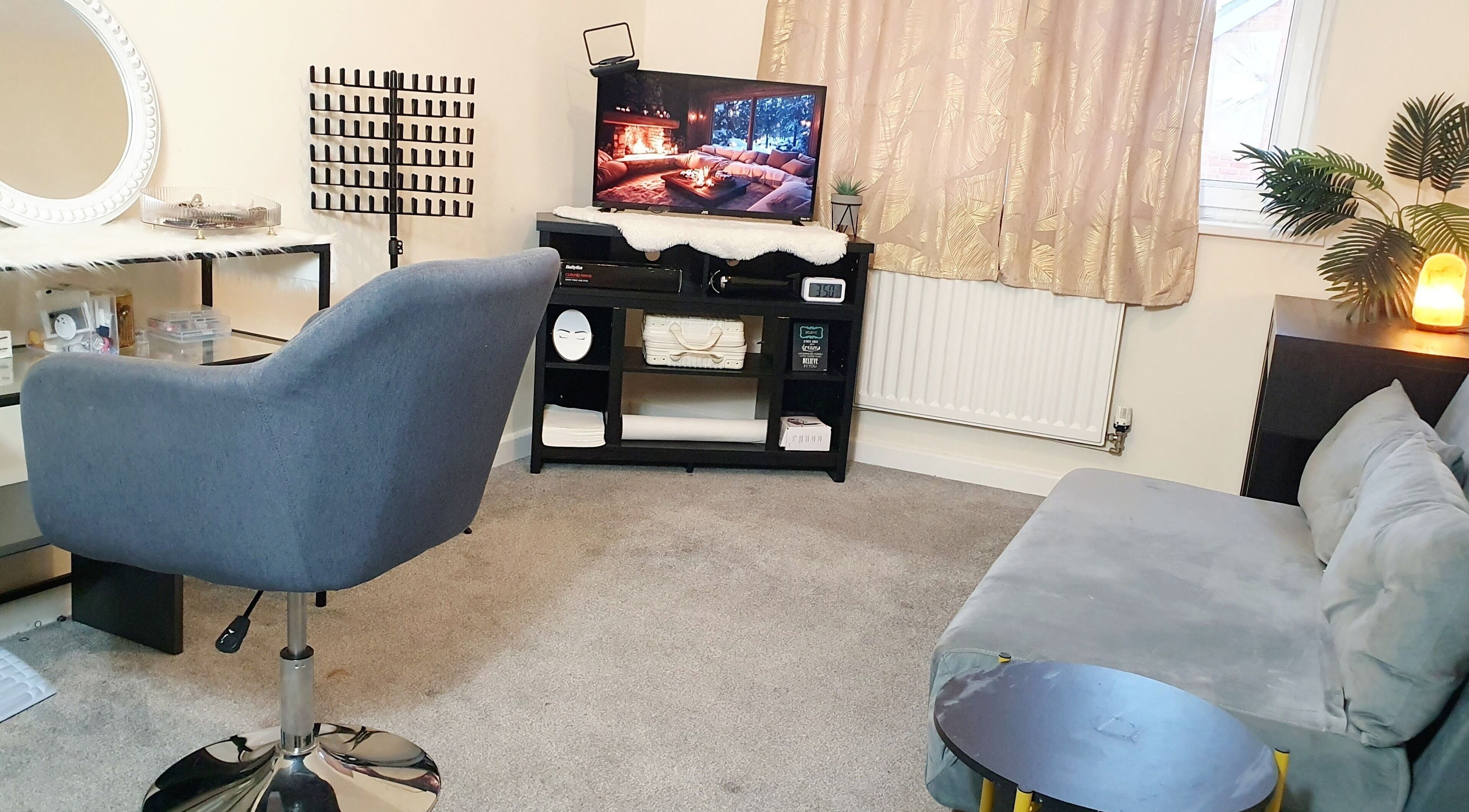 A cozy salon interior at Jax Luxthetics, Swindon, England, GB, featuring a modern chair and elegant decor.