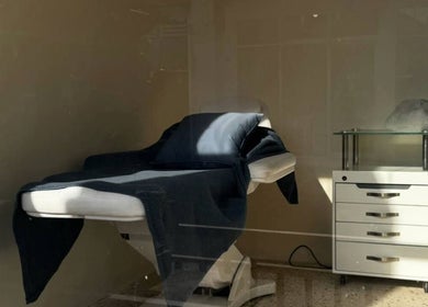 Luxurious spa treatment room at Suka Kuku, Bali, Bali, ID featuring a cozy treatment bed.