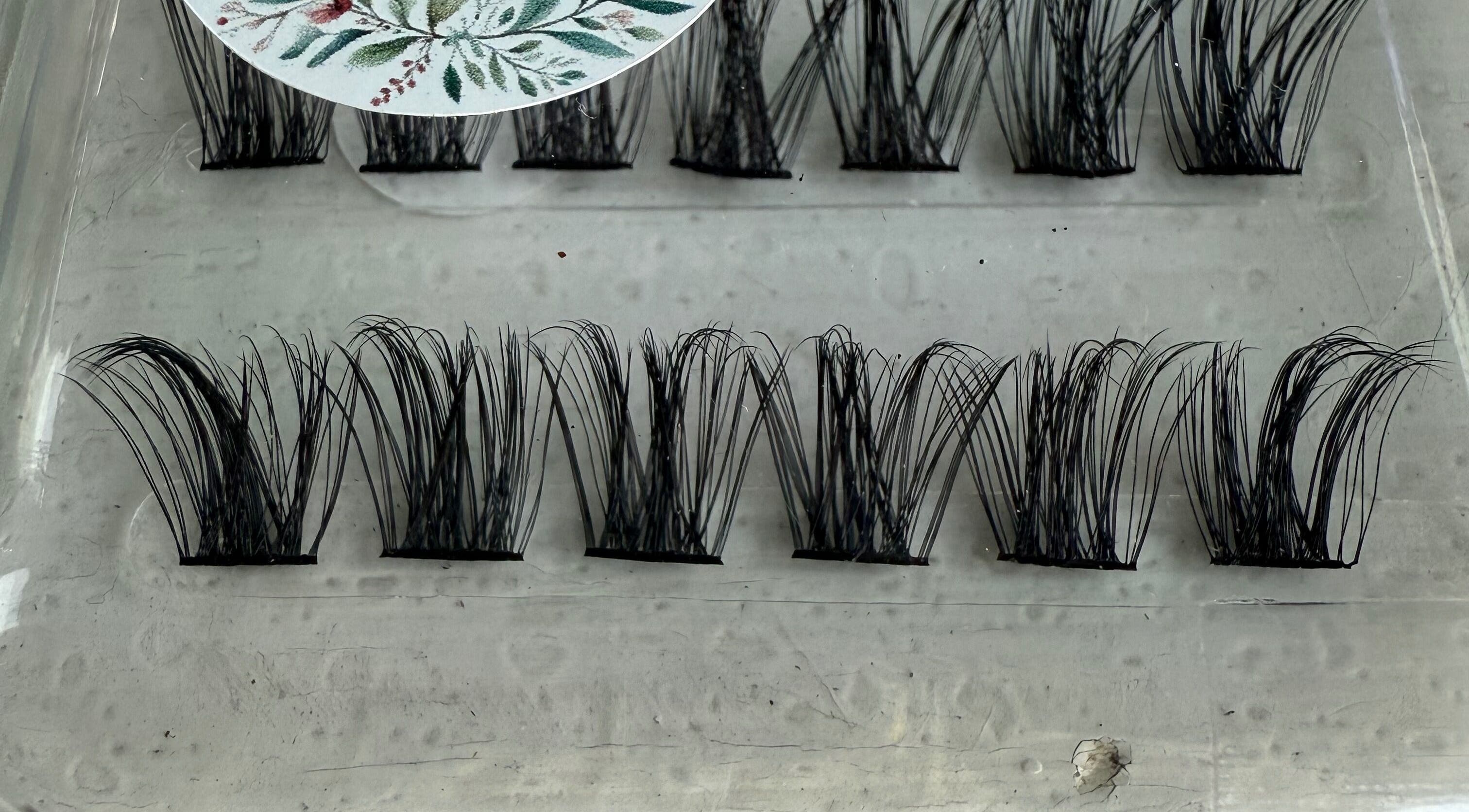 Cluster lash extensions from Sei Bello in Gqeberha, Eastern Cape, ZA, showcasing intricate lash detail.