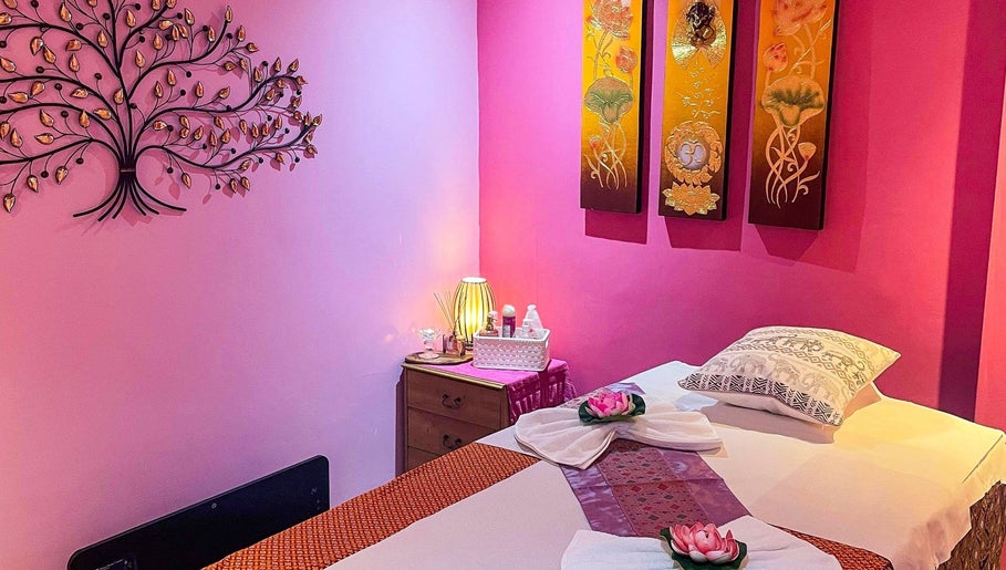 Relaxing massage room at Bua Siri Thai Massage, Bournemouth, England, GB with calming pink decor.