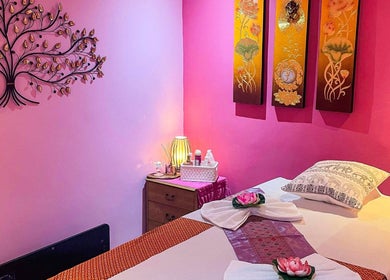 Relaxing massage room at Bua Siri Thai Massage, Bournemouth, England, GB with calming pink decor.