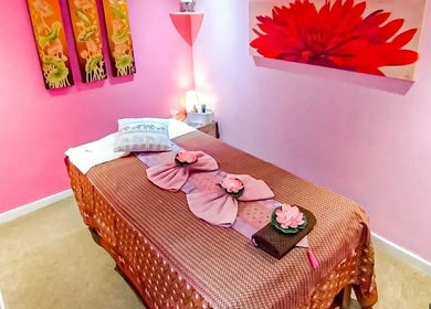 Relaxing massage room at Bua Siri Thai Massage, Bournemouth, England, GB, adorned with floral decor.
