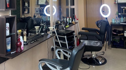 Modern interior of VN Vision Barbershop & hairstyling in Sofia, Sofia City Province, BG featuring stylish chairs and equipment.